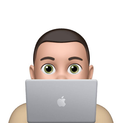 Person peeking from behind laptop